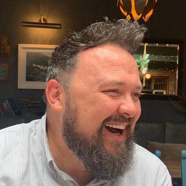 Barry Taylor, laughing
